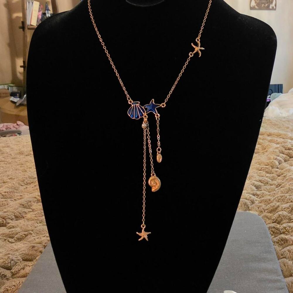 Gold tone stainless steel necklace featuring